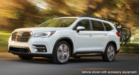 The 2022 Subaru Ascent driving on a road.